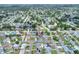 Beautiful aerial view of the property nestled in a lush, green neighborhood with nearby ponds and streets at 2306 33Rd W St, Bradenton, FL 34205