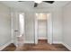 Bedroom with wood-look flooring, neutral walls, closet, and ceiling fan at 2306 33Rd W St, Bradenton, FL 34205