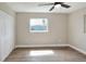 Bedroom with a ceiling fan, window with natural light, and spacious closet at 2306 33Rd W St, Bradenton, FL 34205