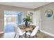 Dining area featuring hardwood floors and sliding glass doors to the pool patio at 2306 33Rd W St, Bradenton, FL 34205