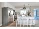 Updated eat-in kitchen featuring quartz countertops, stainless appliances, breakfast bar and hardwood floors at 2306 33Rd W St, Bradenton, FL 34205