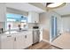 Bright kitchen featuring quartz countertops, modern fixtures, stainless steel appliances, and window views at 2306 33Rd W St, Bradenton, FL 34205