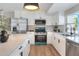 Contemporary kitchen with stainless steel appliances, quartz countertops, and ample cabinet space at 2306 33Rd W St, Bradenton, FL 34205
