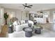 Open-concept living room with modern furnishings, leading into the bright, updated kitchen at 2306 33Rd W St, Bradenton, FL 34205