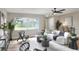 Stylish living area with wood floors, a sleek sofa, and a view of the outdoors at 2306 33Rd W St, Bradenton, FL 34205