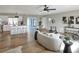 Spacious living room with neutral colors, wood flooring, and an open layout to dining and kitchen at 2306 33Rd W St, Bradenton, FL 34205