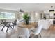 Open-concept living space featuring hardwood floors, neutral paint, and eat-in kitchen at 2306 33Rd W St, Bradenton, FL 34205