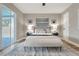 Bright main bedroom featuring hardwood floors, a ceiling fan, and sliding glass door to pool patio at 2306 33Rd W St, Bradenton, FL 34205