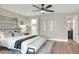 Neutral main bedroom featuring hardwood floors, neutral paint, and en suite bathroom at 2306 33Rd W St, Bradenton, FL 34205