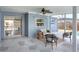 Covered patio with modern seating, ceiling fan, and view of the backyard at 2306 33Rd W St, Bradenton, FL 34205