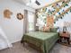 A room with jungle theme, including a tree art, giraffe plushy and stuffed lion and zebra at 35392 Coventry Fields Loop, Zephyrhills, FL 33541