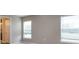 Neutral bedroom with ample natural light, large windows, and a view of the outdoors at 35402 Coventry Fields Loop, Zephyrhills, FL 33541