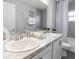 Elegant bathroom with double sinks, modern fixtures, and plenty of counter space at 35494 Coventry Fields Loop, Zephyrhills, FL 33541