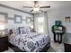 Stylish bedroom featuring unique decor, a ceiling fan, and ample natural light at 35494 Coventry Fields Loop, Zephyrhills, FL 33541