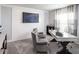 Comfortable den with carpet, a wall-mounted television, decorative shiplap, and ample natural light at 35494 Coventry Fields Loop, Zephyrhills, FL 33541