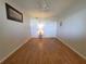 Cozy bedroom with wood flooring, a ceiling fan, and double closet doors, providing storage and comfort at 1893 Shore S Dr # 208, South Pasadena, FL 33707