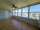 Bright sunroom with ceiling fan and large windows overlooking the waterfront view at 1893 Shore S Dr # 208, South Pasadena, FL 33707