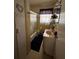 Cozy bathroom with a shower-tub combo, a sink, and a storage shelf at 4108 W Euclid Ave, Tampa, FL 33629