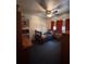 Comfortable bedroom featuring a ceiling fan, a window, and dark blue carpet at 4108 W Euclid Ave, Tampa, FL 33629