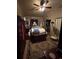 Cozy bedroom with ceiling fan, large dresser, carpet and a four-poster bed at 4108 W Euclid Ave, Tampa, FL 33629