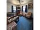 Bright bedroom with hardwood floors, a bed, two chairs, and ample natural light at 4108 W Euclid Ave, Tampa, FL 33629