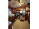 Functional kitchen with wood cabinets, a stainless steel refrigerator, and a ceiling fan at 4108 W Euclid Ave, Tampa, FL 33629