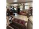 Cozy living room with tile floors, large windows and home office area at 4108 W Euclid Ave, Tampa, FL 33629