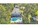 Aerial shot showcases the home's backyard and kidney-shaped pool, providing a private outdoor retreat at 4818 Huron St, Zephyrhills, FL 33541