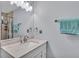 Clean bathroom with a vanity, mirror, and towel rack at 4818 Huron St, Zephyrhills, FL 33541