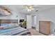 Comfortable bedroom with wood-look flooring, closet, and modern decor at 4818 Huron St, Zephyrhills, FL 33541