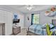Cozy bedroom featuring a ceiling fan, natural light, and modern finishes at 4818 Huron St, Zephyrhills, FL 33541