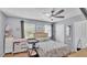 Light-filled bedroom with a ceiling fan and a neutral color palette at 4818 Huron St, Zephyrhills, FL 33541