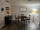 Comfortable dining room with a wooden table, perfect for Gathering meals and gatherings at 4818 Huron St, Zephyrhills, FL 33541