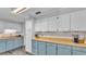 Bright kitchen featuring modern appliances, wood countertops, and ample cabinet space at 4818 Huron St, Zephyrhills, FL 33541