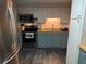 Well-equipped kitchen featuring stainless steel appliances, butcher block countertops, and plenty of cabinet storage at 4818 Huron St, Zephyrhills, FL 33541
