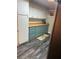 Charming kitchen with butcher block counters, white and light blue cabinets, and modern appliances at 4818 Huron St, Zephyrhills, FL 33541