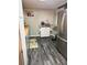 Cozy kitchen featuring a stainless steel refrigerator, butcher block counters, and light blue cabinetry at 4818 Huron St, Zephyrhills, FL 33541