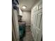 Laundry room features cabinetry, a washer and dryer, tile flooring, and laundry baskets at 4818 Huron St, Zephyrhills, FL 33541