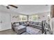 Cozy living room with a plush sectional sofa, soft rug, and lots of natural light at 4818 Huron St, Zephyrhills, FL 33541