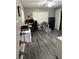Home office with wood look tile flooring, a safe, and chair at 4818 Huron St, Zephyrhills, FL 33541