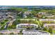 Aerial view of the community displaying condo buildings, surrounding greenery, and proximity to Tampa Bay at 5980 80Th N St # 408, St Petersburg, FL 33709