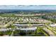 Wide aerial view of the condo community, highlighting the surrounding greenery and convenient location at 5980 80Th N St # 408, St Petersburg, FL 33709