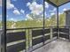 Screened in balcony with beautiful view of trees and bright blue skies at 5980 80Th N St # 408, St Petersburg, FL 33709