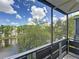 Screened balcony with a view of the pond and lush greenery at 5980 80Th N St # 408, St Petersburg, FL 33709