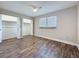 Bright bedroom featuring modern ceiling fan, large closets, and sleek, updated flooring throughout the room at 5980 80Th N St # 408, St Petersburg, FL 33709