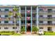 Exterior of building showcasing balconies with patriotic decorations at 5980 80Th N St # 408, St Petersburg, FL 33709
