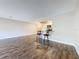 Bright, open-concept living area with breakfast bar that peers into kitchen, wood floor at 5980 80Th N St # 408, St Petersburg, FL 33709