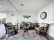 Cozy lobby showcasing comfortable seating, stylish decor, and a clock on the wall at 5980 80Th N St # 408, St Petersburg, FL 33709