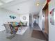 Hallway view of the lobby area featuring cozy seating and an elevator at 5980 80Th N St # 408, St Petersburg, FL 33709