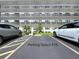 Exterior view of parking space marked by parking space #16 near the condo at 5980 80Th N St # 408, St Petersburg, FL 33709